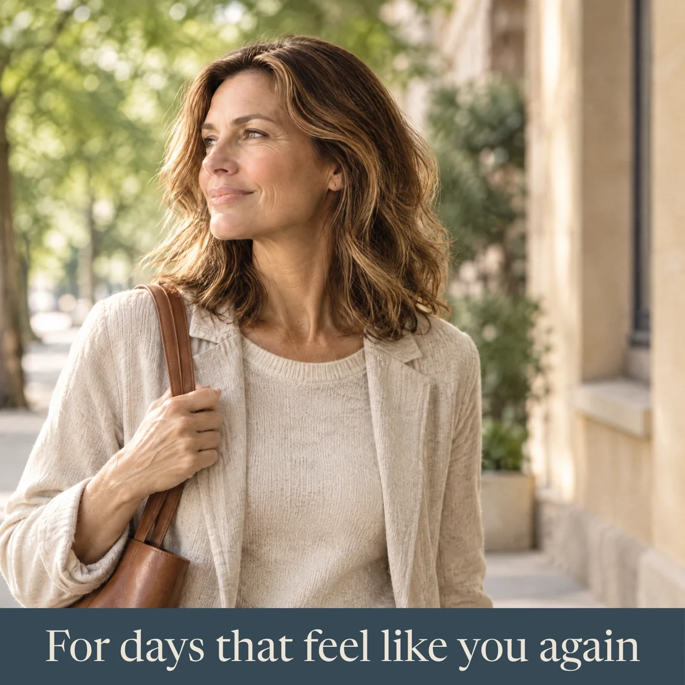 Smiling woman in a linen jacket walking down a sunny, tree-lined street. Text: For days that feel like you again